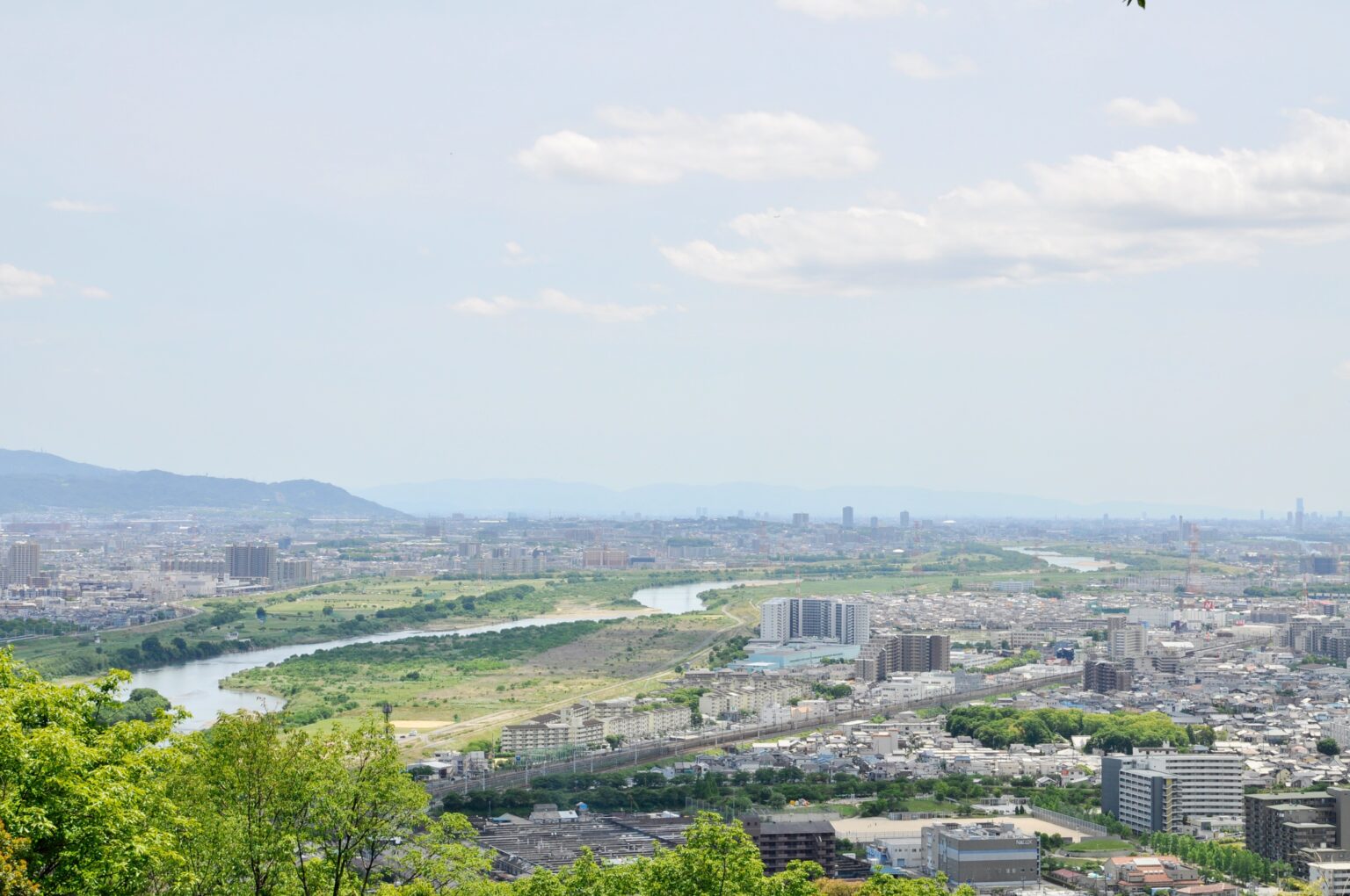 Birds-eye view of a city with a river running through it