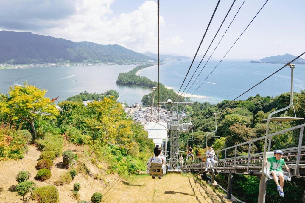 A ropeway descending to a seaside town