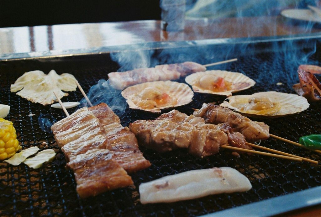 Meat, seafood, and vegetables on a grill