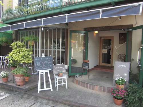 Cafe Tabi Tabi storefront with outdoor seating area and large windows